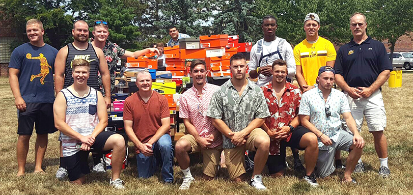 Football Team Donates School Supplies to Children for 15th Straight Year