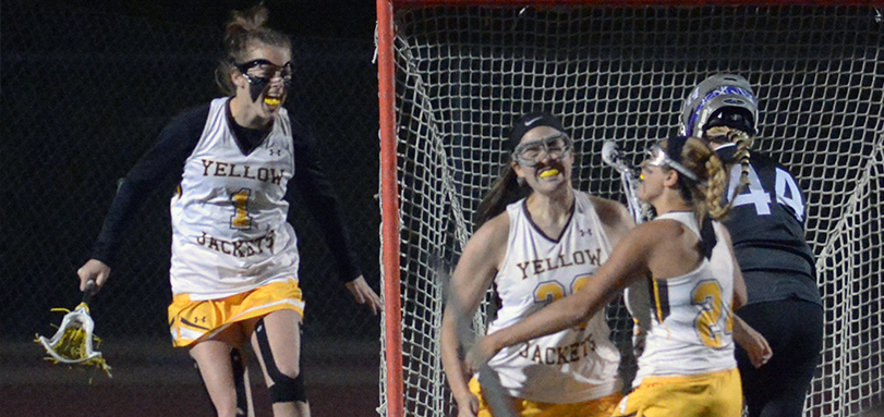 Hannah Albrechta celebrates with Kayla Miller and Brie Martineau after scoring game-winning goal in overtime