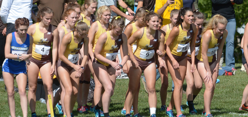 The women's cross country team lines up for the race (Photo by Milton Woods)