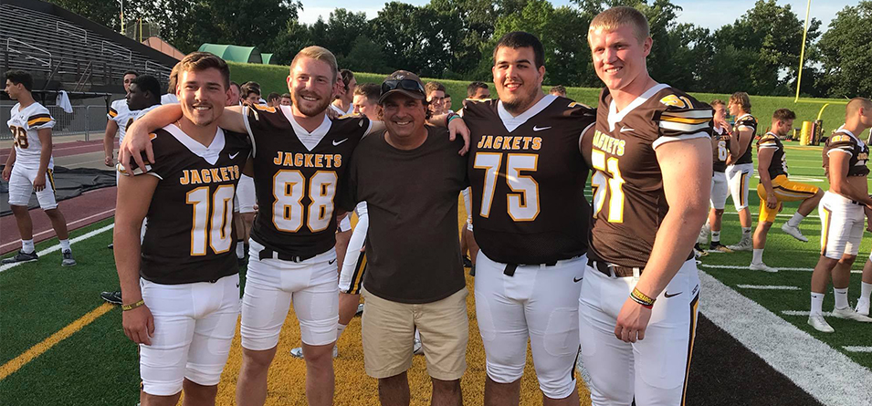 Miller (center) with former student-assistants and football student-athletes Jake Hudson '19, Ty Ramsier '19, Willy Hedberg '19 and Daulton Znosko '19