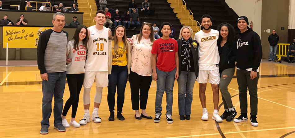 Seniors Jay Battle and Kyle Nader accompanied by family for Seniors' Night
