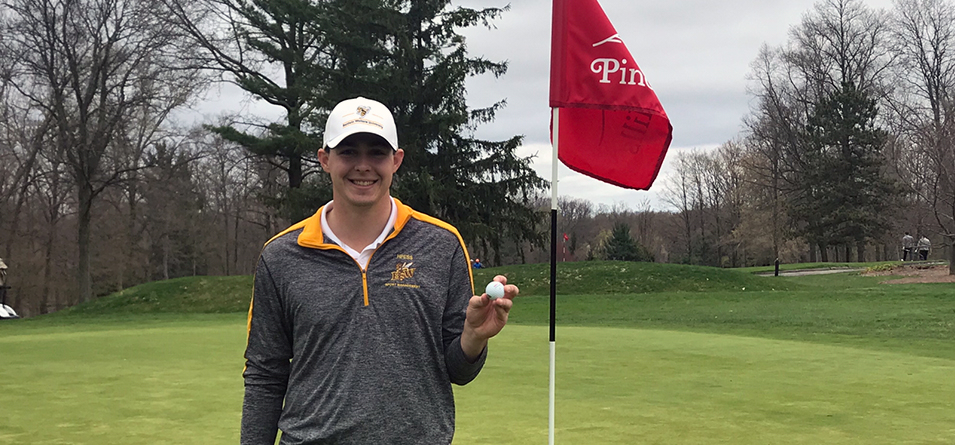 Hunter Miller holds the ball after firing his career hole-in-one on the eighth hole. (Photo Courtesy of Brendan Gulick)