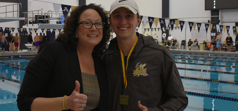 Back-to-Back 200-yard butterfly OAC Champion Tommie McQueary and Head Coach Laura Demaline