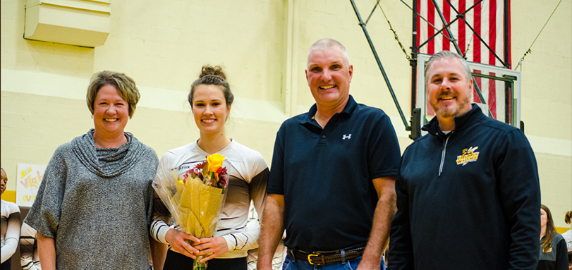 Senior Alicia Lortcher with parents and head coach Scott Carter on Seniors' and Parents' Day (Photo Courtesy of Lori Kumorek)