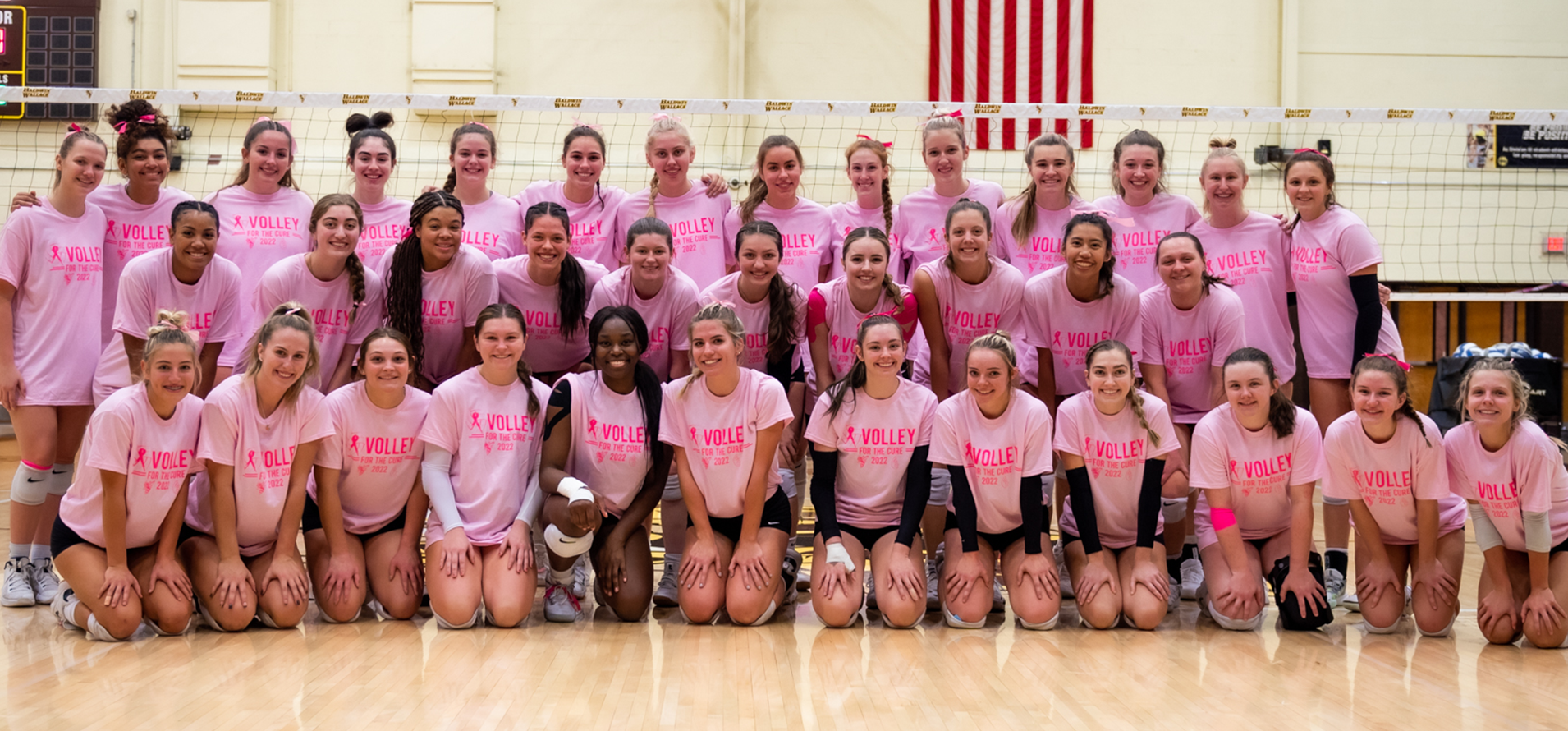 The Baldwin Wallace University and Wilmington College women's volleyball teams pictured before the 2022 Volley for the Cure Match (photo courtesy of Kevin Wilker '26)